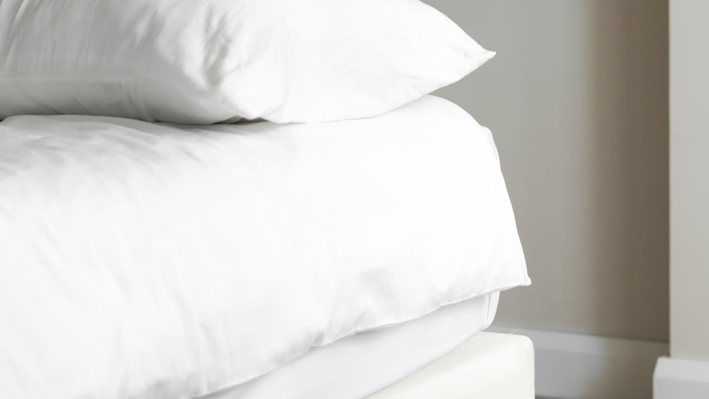 How Sleep and Gut Health Are Connected - white bed sheets