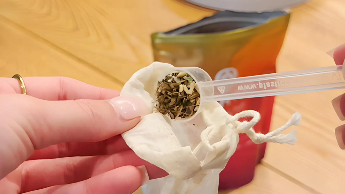 lady putting cosmic hue tea into reusable organic cotton tea bag ready to brew tea