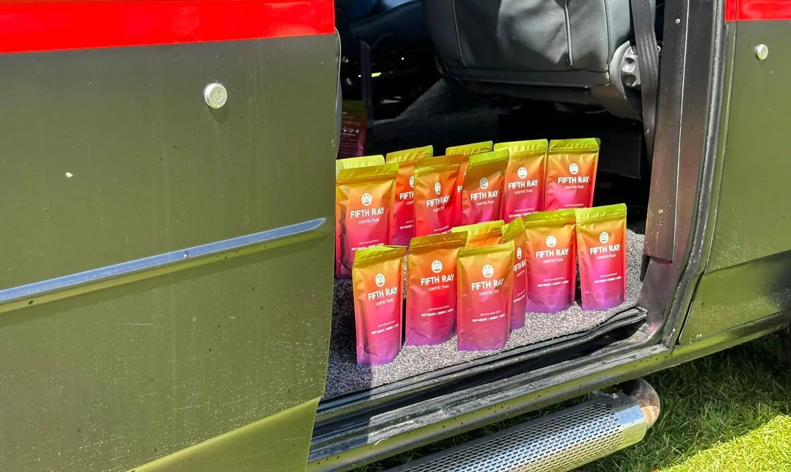 packages of cosmic hue tea in van door