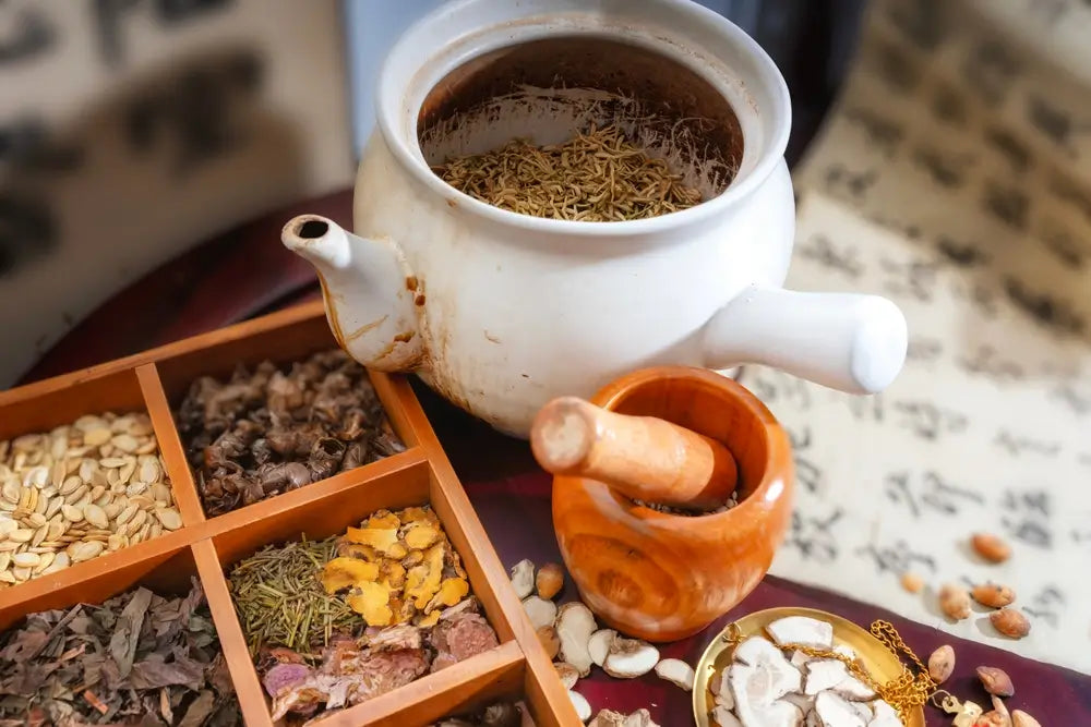 Traditional Herbal Tea Preparation with Ingredients and Tools