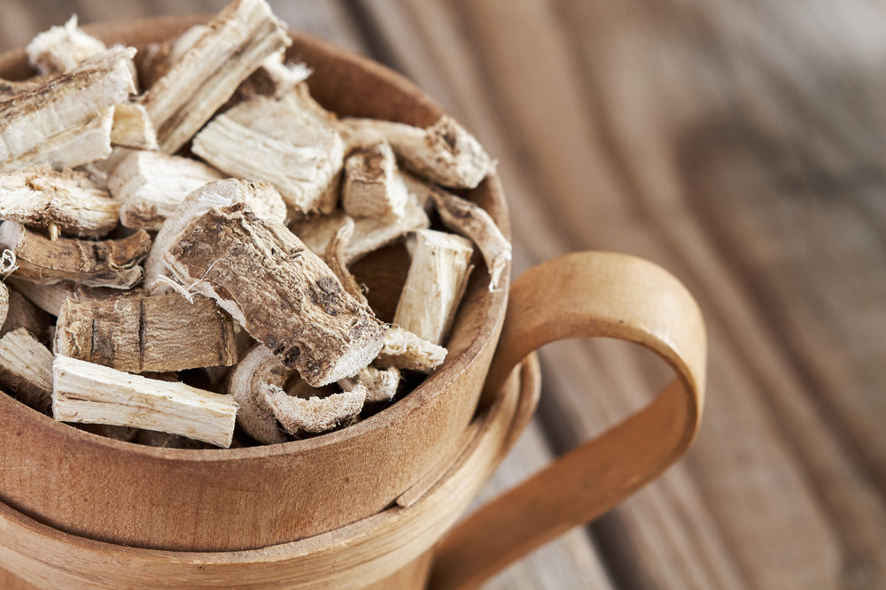 Close-up of marshmallow root (Althaea officinalis) in wooden cup